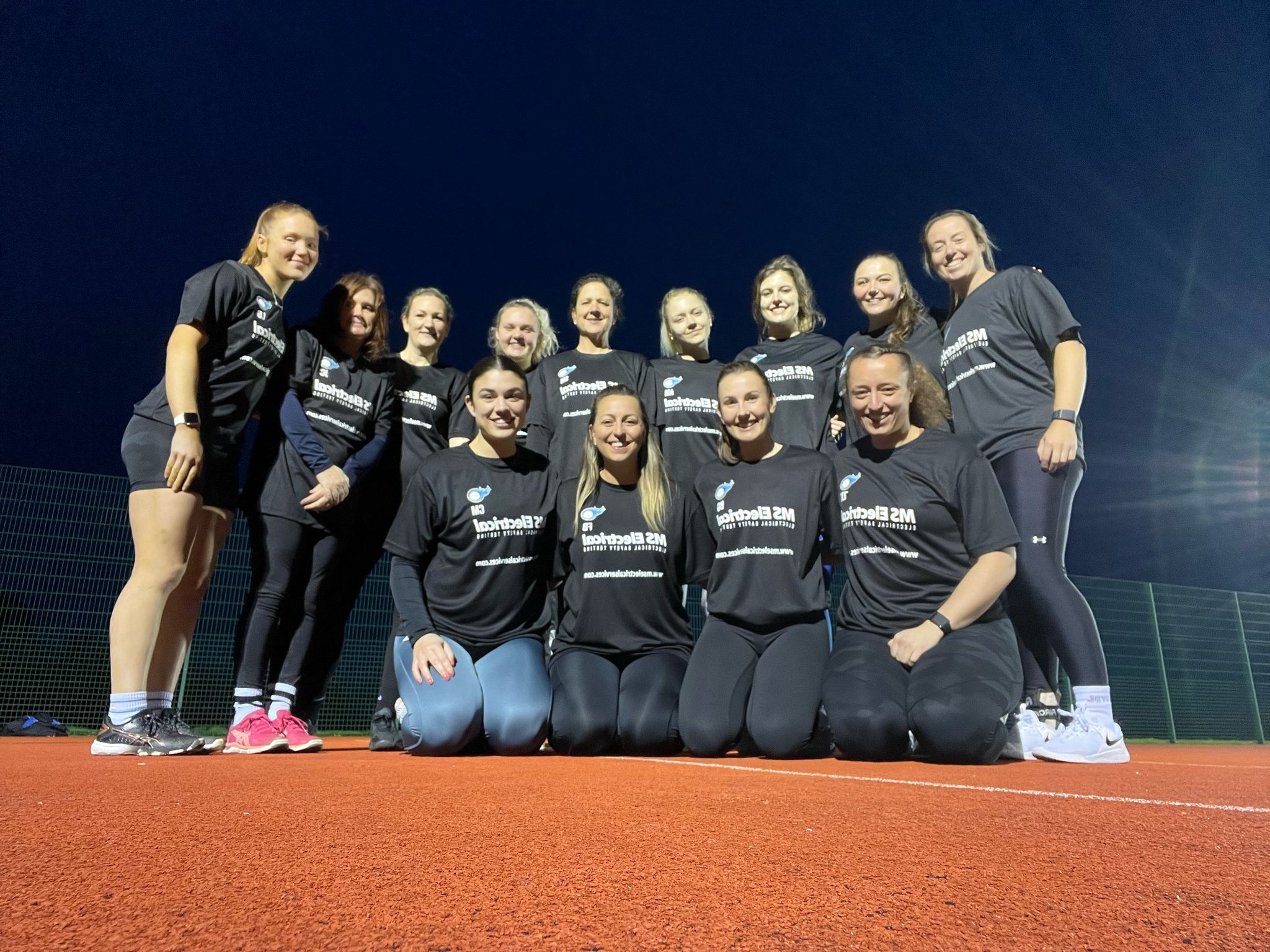 Team Showing Off Their Sponsored T-Shirts
