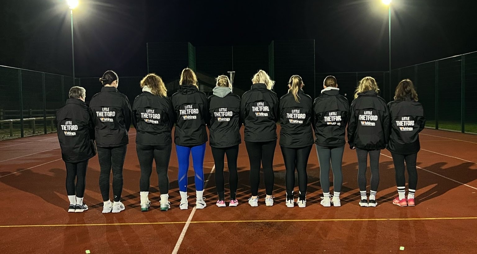 Team Showing Off Their Sponsored Jackets